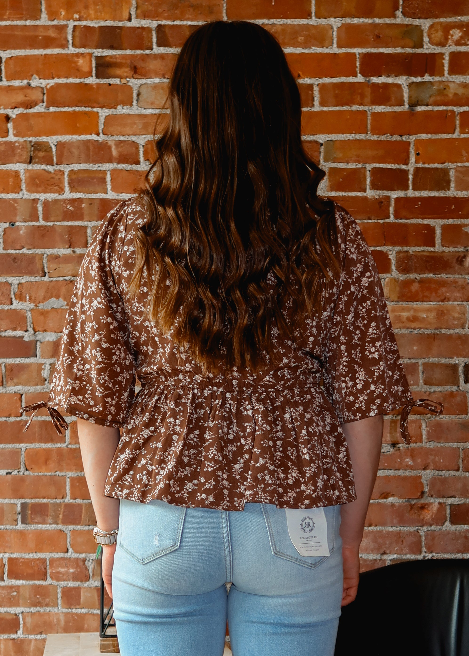 Happiness Trails Boutique - Brown peplum blouse with cream floral print
