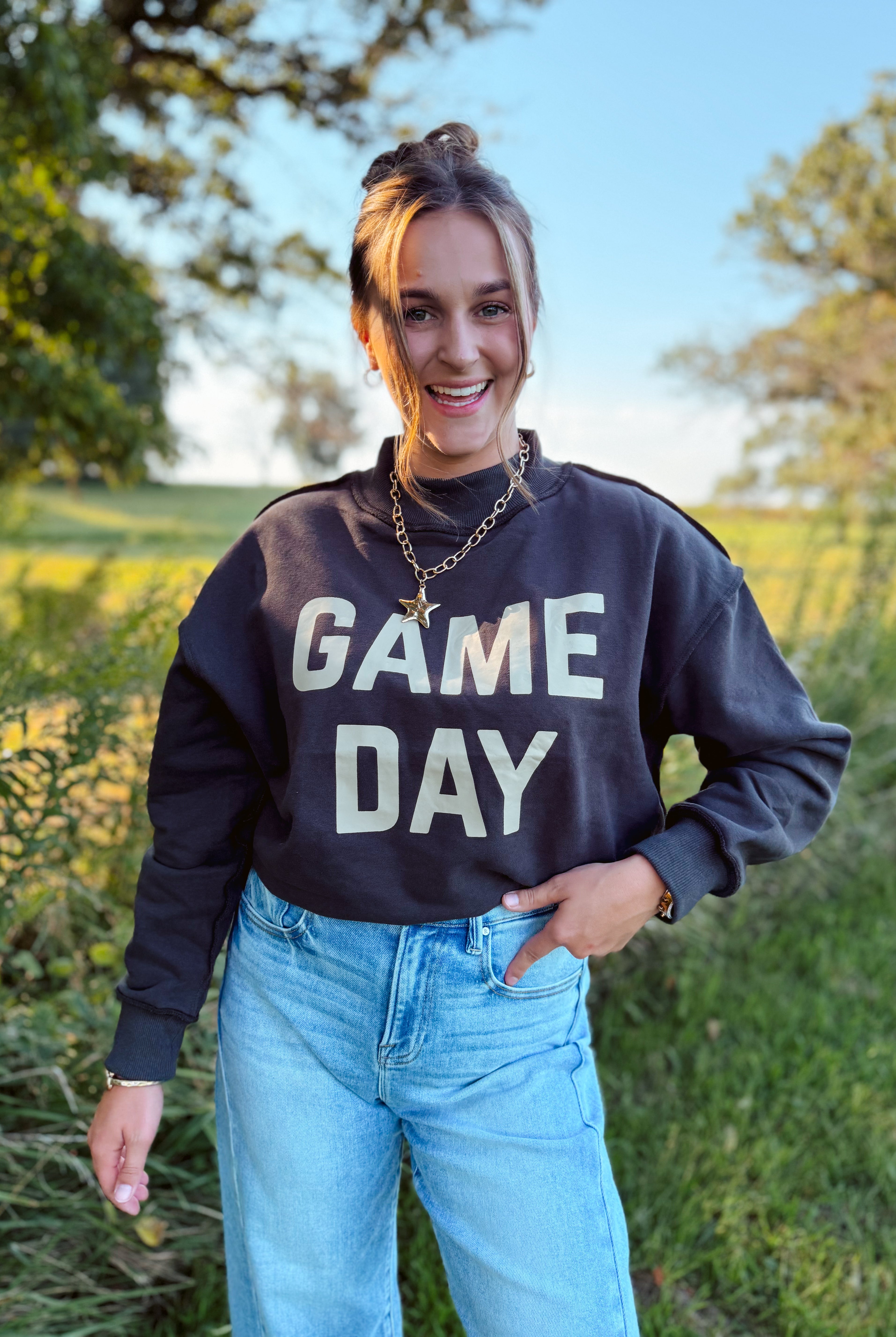 Happiness Trails Boutique - reversible Game Day sweatshirt! Featuring “Game Day” printed on one side and “Sunday Funday” on the reverse, this dark gray sweatshirt