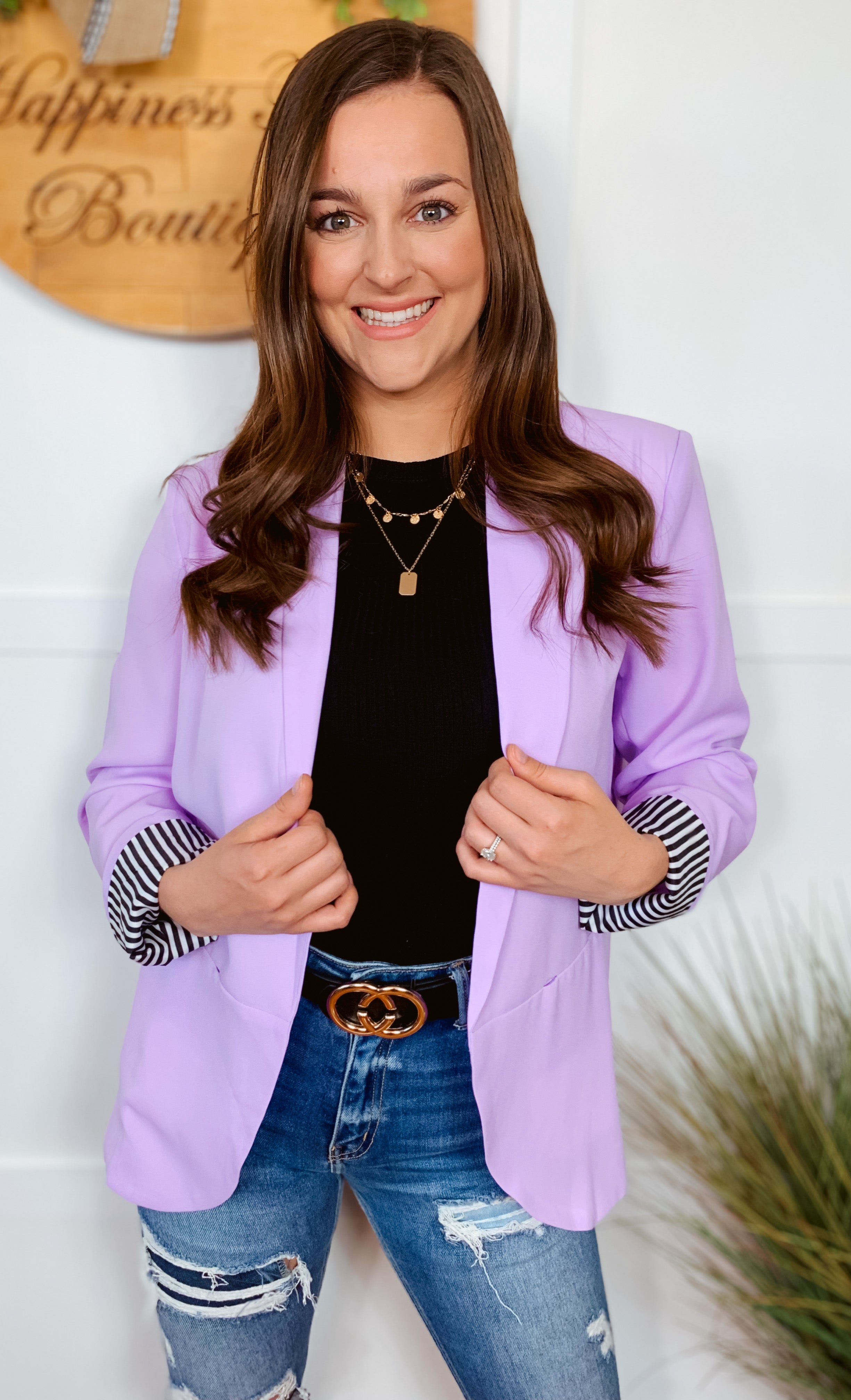 The beautiful lavender fabric with a striped contrasting rolled sleeves is the perfect fashion statement. It features an open style front and functioning pockets for added convenience.