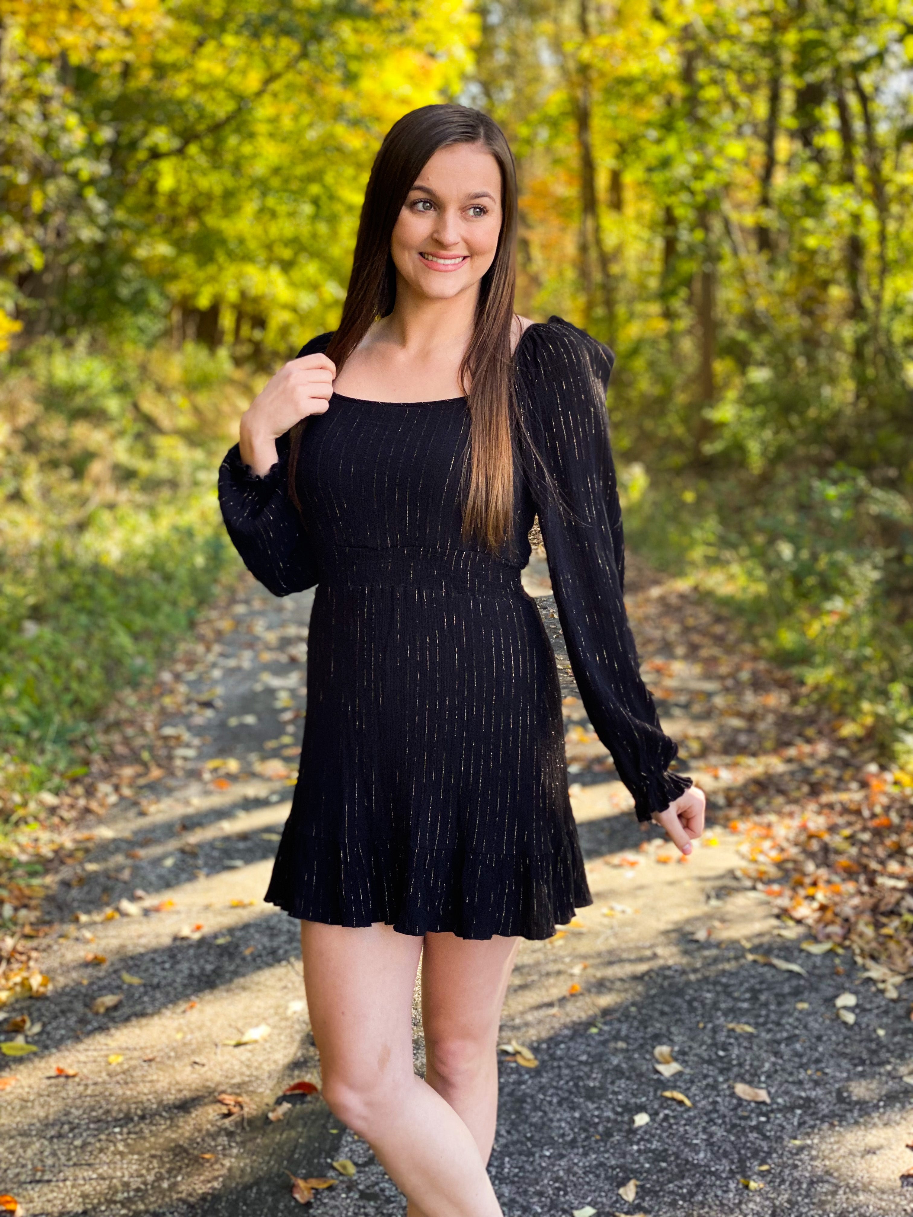 Black dress with gold pin stripes