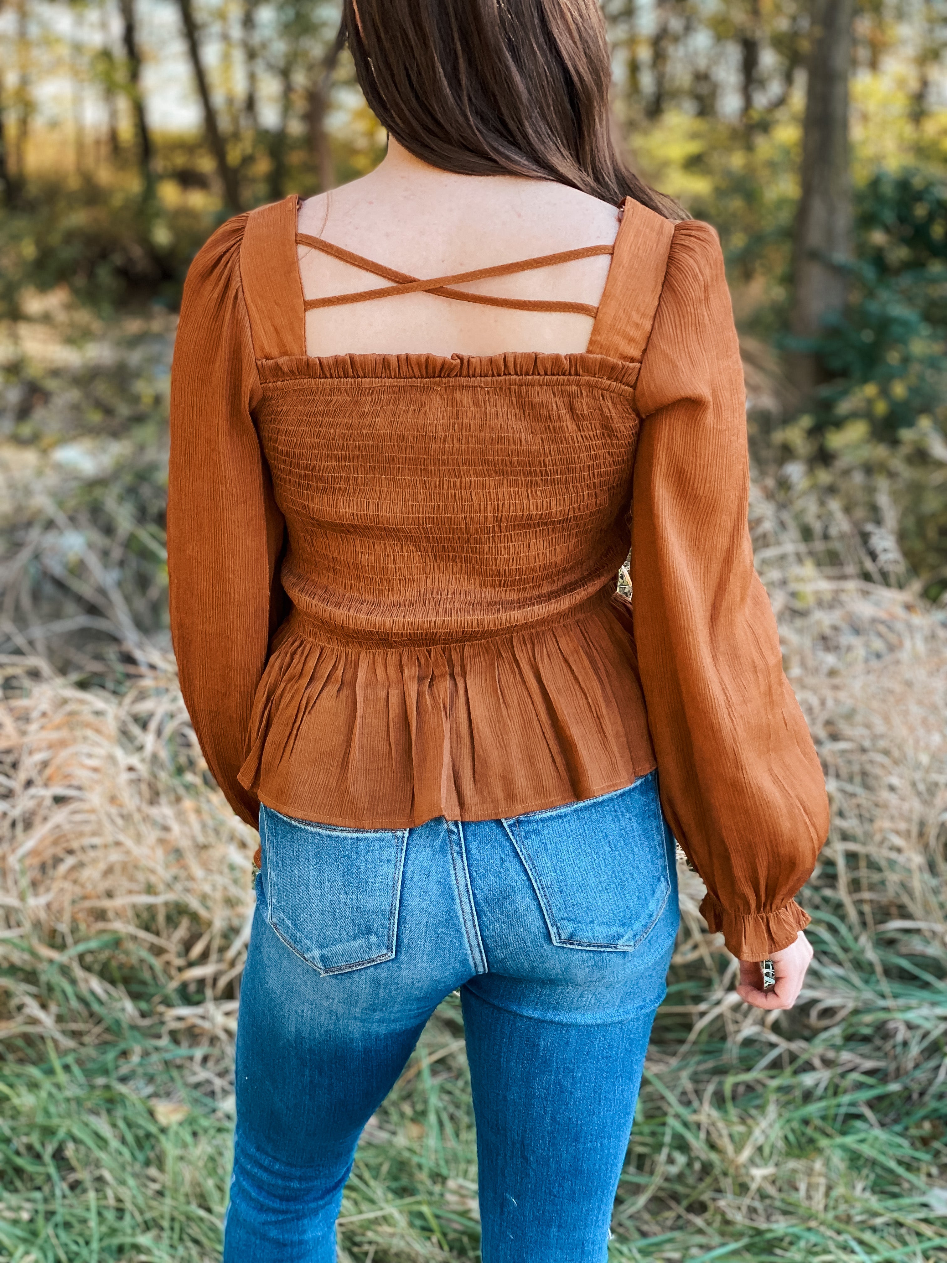 This smocked peplum top is adorable in the camel color.