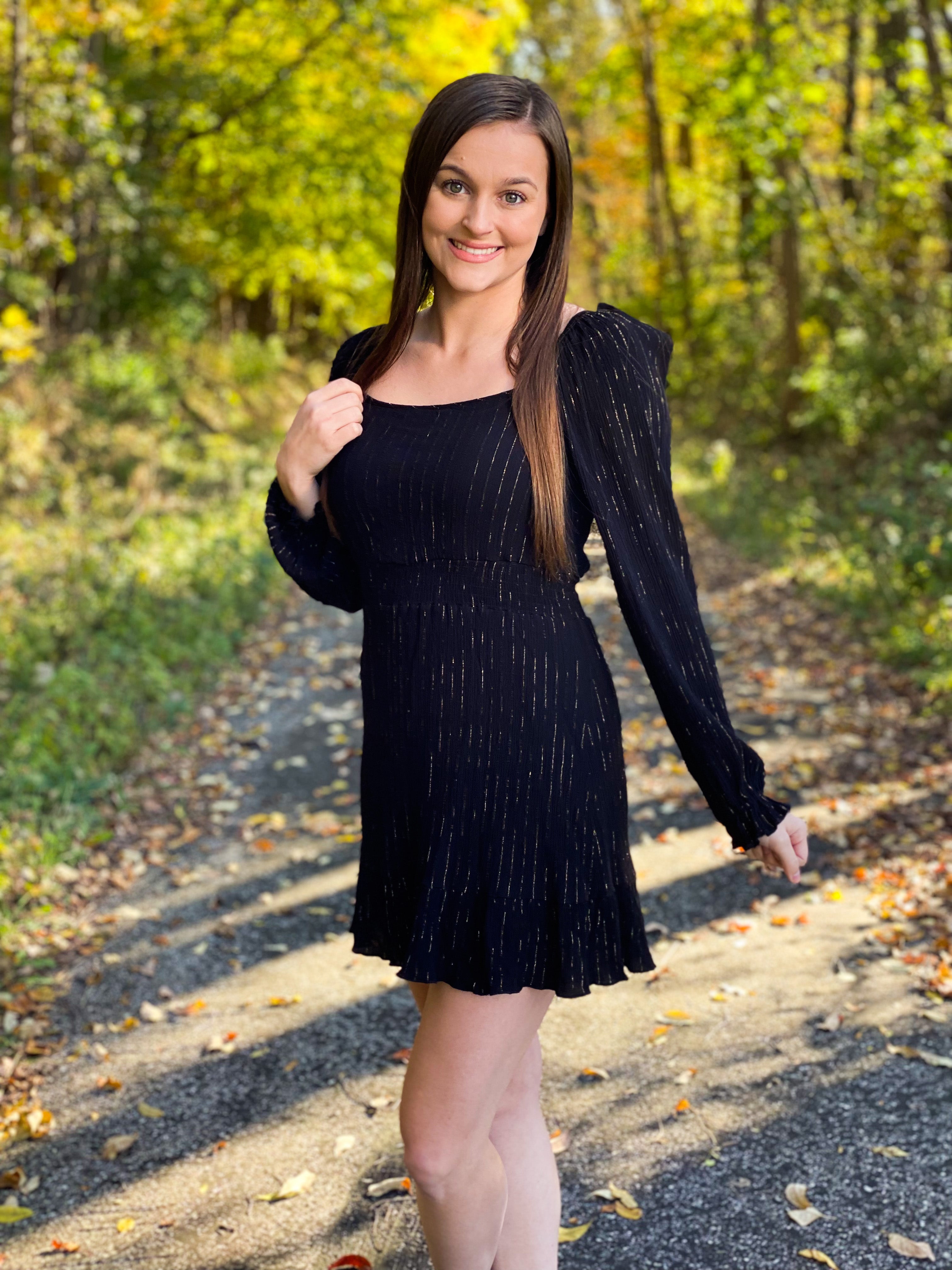Black dress with gold pin stripes