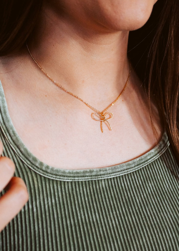 Gold ribbon bow necklace