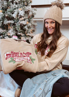 Happiness Trails Boutique - Have A Holly Jolly Christmas screen printed on an oatmeal sweatshirt