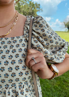 Happiness Trails Boutique - A soft neutral oatmeal tone beautifully complemented by blue floral accents dress