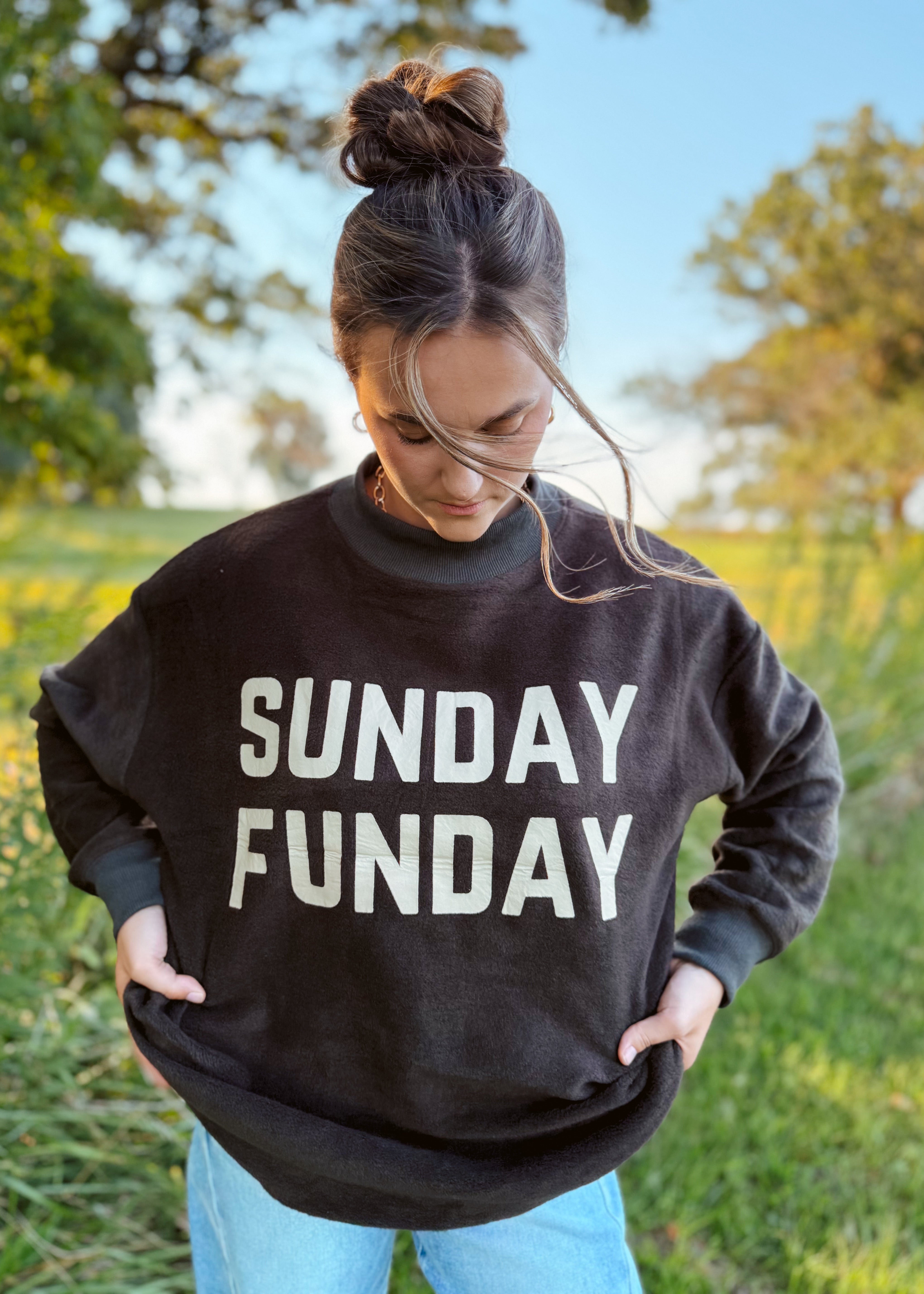Happiness Trails Boutique - reversible Game Day sweatshirt! Featuring “Game Day” printed on one side and “Sunday Funday” on the reverse, this dark gray sweatshirt