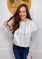Mama screen printed on a light grey colorblock cropped hooded sweatshirt