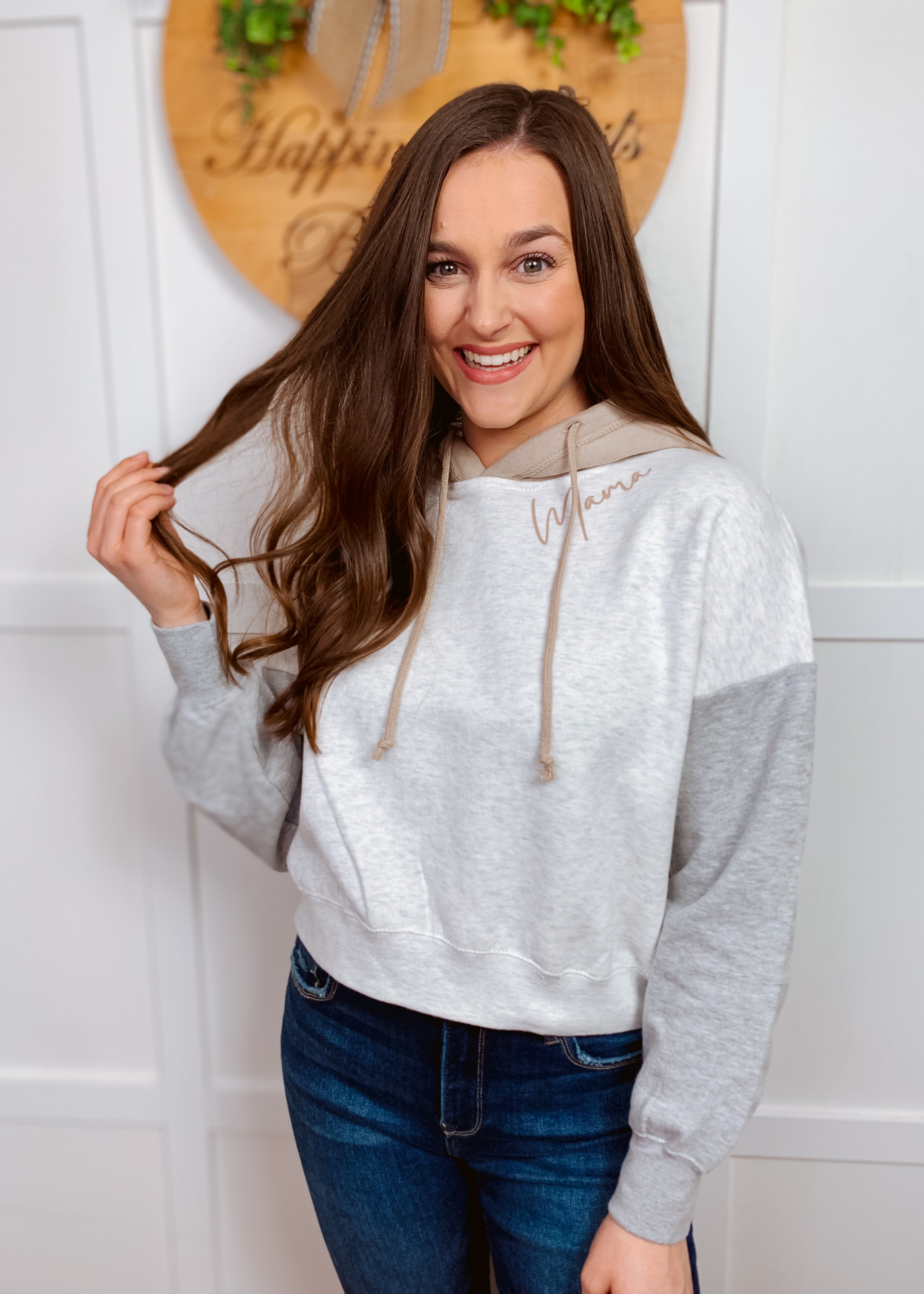 Mama screen printed on a light grey colorblock cropped hooded sweatshirt