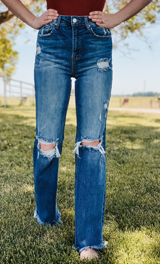 These Rena Risen High Rise Distressed Straight Jeans are perfect for making a statement.
